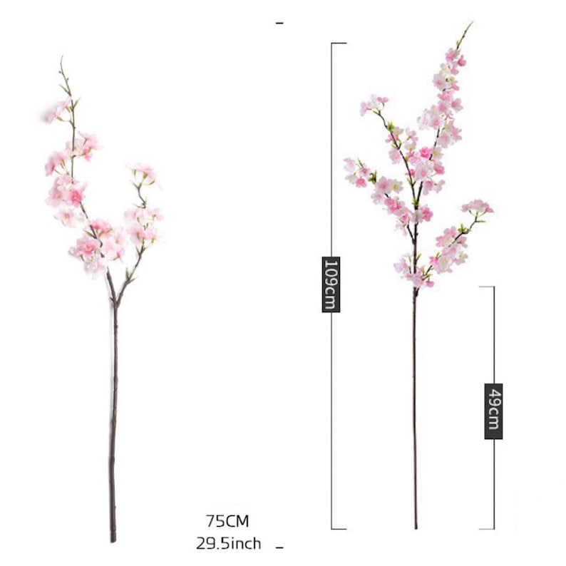 May include: Two artificial cherry blossom branches with pink flowers. The branch on the left is 29.5 inches tall and the branch on the right is 43 inches tall.