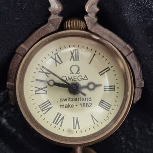 OMEGA Montre boule pendentif remontage manuel fonctionne