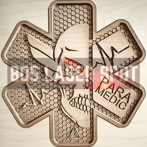 May include: A wooden Star of Life emblem with a skull design and the word "PARAMEDIC". The emblem has a honeycomb pattern and the text "805 LASER SPOT".