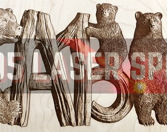 May include: Wooden sign with the word "CABIN" carved into it. The letters are surrounded by carved images of bears.