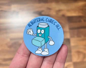 May include: A blue and green cartoon inhaler with a smiling face and the text "Albuterol Cures All" on a blue circle sticker.