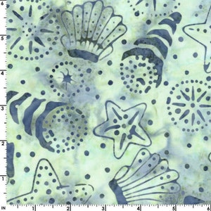 May include: A light green fabric with a blue and white pattern of seashells, starfish, and other ocean-themed designs.