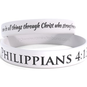 May include: White silicone wristband with the text "I can do all things through Christ who strengthens me" and "PHILIPPIANS 4:13" in black.