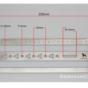 May include: A silver metal ruler with a scale in centimeters and inches. The ruler has a variety of cutouts for leather crafting, including circles, triangles, and rectangles. The ruler is 220 mm long and has a small dog logo with the text "Geji Leather".