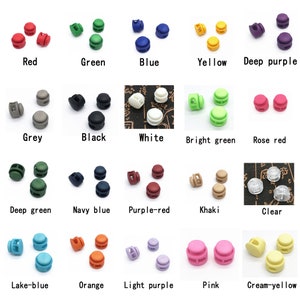 May include: Assortment of plastic slider buckles in various colors, including red, green, blue, yellow, deep purple, grey, black, white, bright green, rose red, deep green, navy blue, purple-red, khaki, clear, lake-blue, orange, light purple, pink, and cream-yellow.