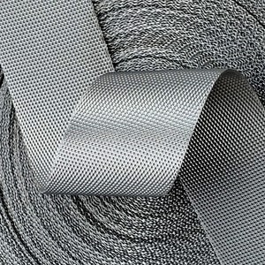 May include: Close-up of a roll of silver gray webbing with a textured surface.