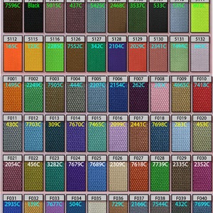 May include: A colour chart with 100 different fabric swatches. Each swatch is labelled with a number and a colour code. The swatches are arranged in rows and columns.