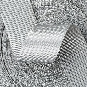 May include: A roll of silver gray webbing with a textured surface. The webbing is rolled up and the end is folded over.