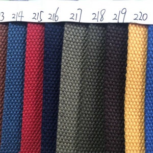 May include: A color chart of fabric swatches, numbered 211 to 222, showing a variety of colors and textures. The swatches are arranged in a horizontal row.