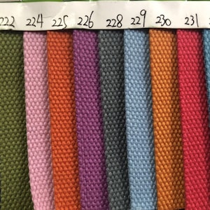May include: A color chart of fabric samples, showing 14 different colors, including yellow, blue, green, pink, orange, purple, gray, light blue, gold, red, and burgundy.