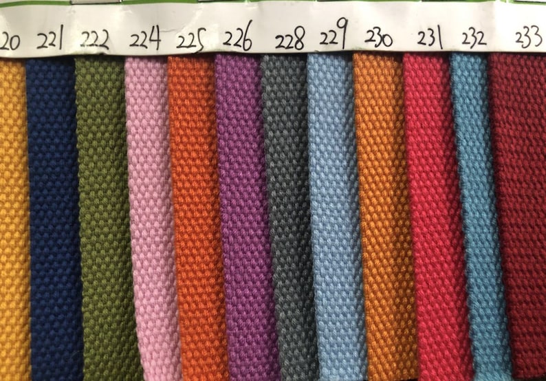 May include: A color chart of fabric samples, showing 14 different colors, including yellow, blue, green, pink, orange, purple, gray, light blue, gold, red, and burgundy.