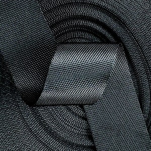 May include: A close-up of a black woven fabric with a textured pattern. The fabric is folded and twisted, creating a knot-like shape.