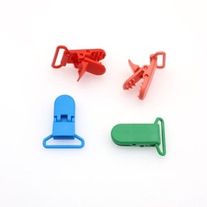 25 mm プラスチック製おしゃぶりクリップ、サスペンダークリップホルダー、Nuk ダミービブリーシュスナップ、ホワイトミトン生地おしゃぶりクリップ 12 個