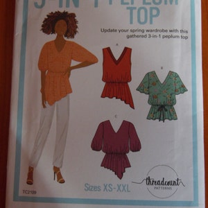 May include: A sewing pattern for a 3-in-1 peplum top. The pattern features illustrations of the top in different styles, with a woman wearing one version. Text includes "3-IN-1 PEPLUM TOP", "Sizes XS-XXL", and "threadcount PATTERNS".