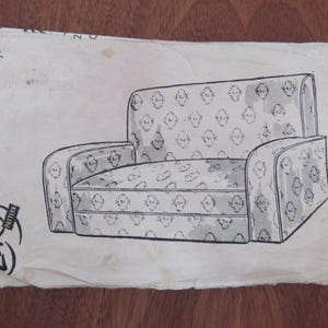 May include: A white ceramic mug with a black handle and the text "But First, Coffee" in a black, handwritten-style font. The mug is on a white surface.