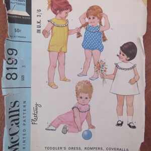 May include: Vintage McCall's pattern 8199 for toddler dresses, rompers, and playsuits. The illustration shows four children in different outfits: a yellow romper, a blue polka-dot romper, a white dress, and a pink playsuit.