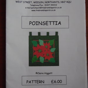 May include: A white paper with the text "BRAMBLE PATCH" and "POINSETTIA" is displayed. The image features a poinsettia design with red flowers and green leaves. The text "PATTERN" and "£6.00" are also visible.