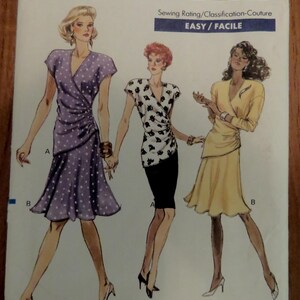 May include: Vogue Patterns 7248 sewing pattern envelope for sizes 12-14-16. The illustration features three outfits: a purple polka dot wrap dress, a white top with black abstract shapes paired with a black skirt, and a solid yellow wrap dress.