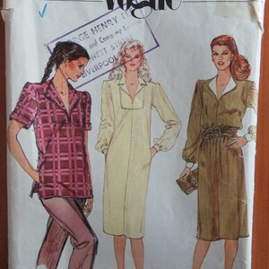 May include: Vogue Very Easy pattern envelope, size 16, featuring illustrations of three different women's outfits. The envelope has the number 7880 and the Vogue logo. The outfits include a plaid top and pants, a long dress, and a belted dress.
