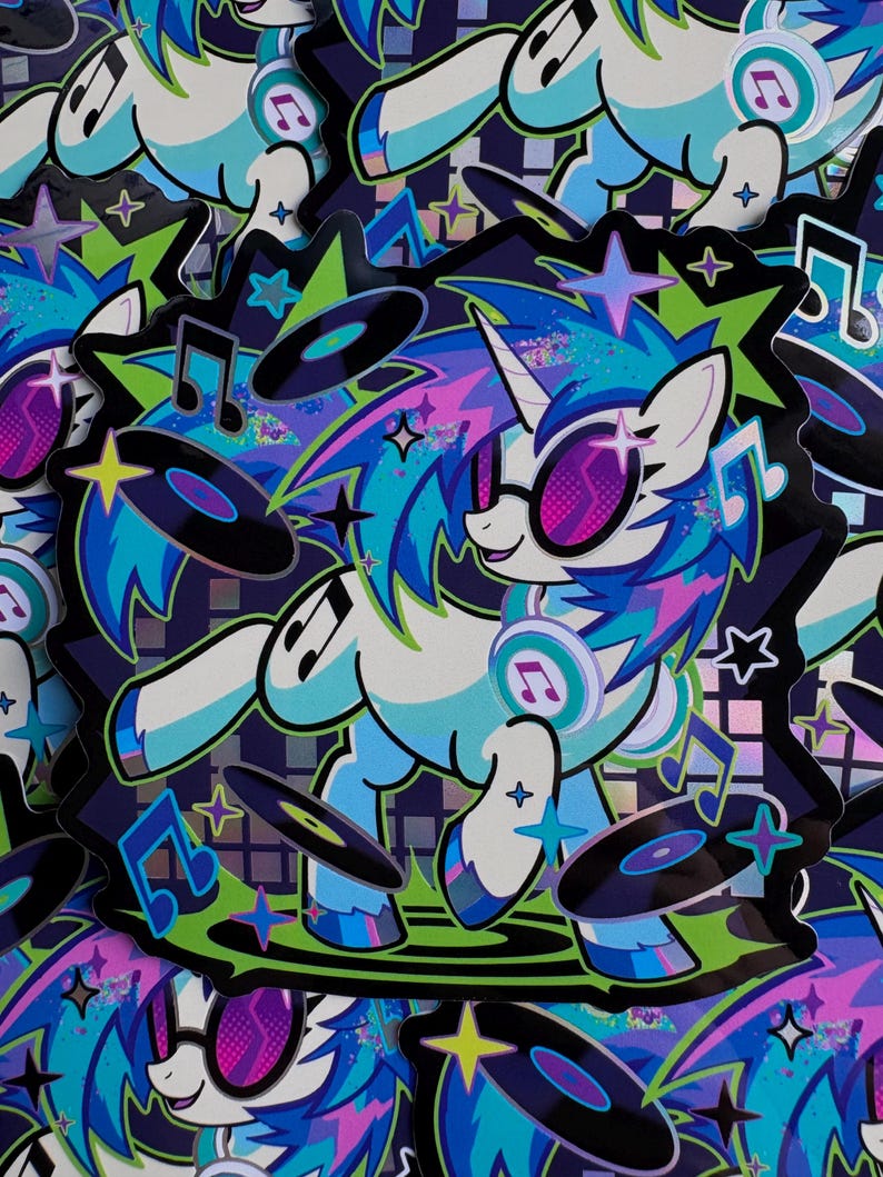 May include: A die-cut sticker featuring a white unicorn with a blue and purple mane, wearing pink-tinted glasses and headphones. The unicorn is surrounded by floating black vinyl records, blue musical notes, and colorful stars on a dark background.