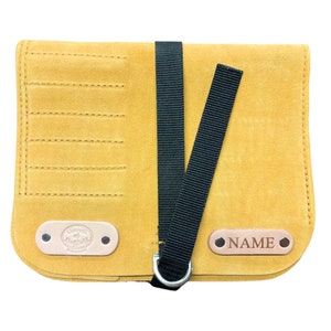 May include: A yellow leather tool roll with a black strap and a metal ring. The roll has a label that says "NAME" and another label that says "Council of Sheffield".