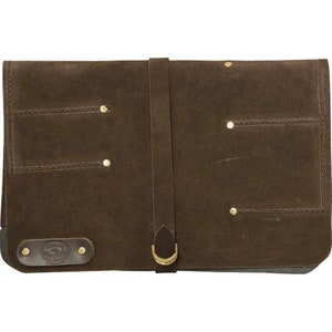 May include: A brown leather tool roll with multiple pockets and a strap closure. The roll has a brass buckle and rivets.