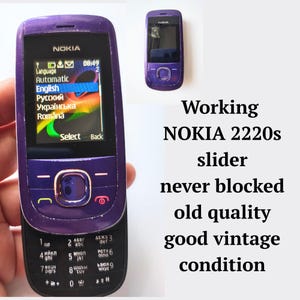 Werkende, nooit geblokkeerde mobiele telefoon NOKIA 2220s mobiele telefoon met schuifknop met drukknop in paars, retro vintage mobiele telefoon uit de jaren 2000