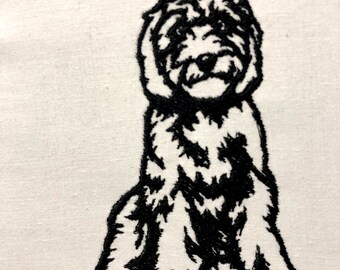 May include: Black and white line art illustration of a sitting dog. The dog has a fluffy appearance and is facing forward.