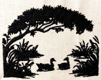 May include: Black and white embroidered design of a tree with two birds in a pond. The tree is arched over the pond and the birds are facing each other.