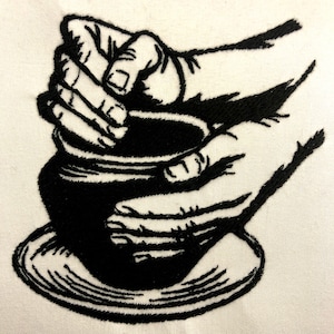 May include: Black and white embroidered image of a hand shaping clay on a pottery wheel.