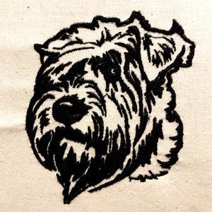 May include: Black and white embroidered image of a dog's head. The dog has a short, wiry coat and a serious expression.