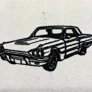 May include: Black and white line drawing of a classic car, possibly a Ford Thunderbird, on a white background.