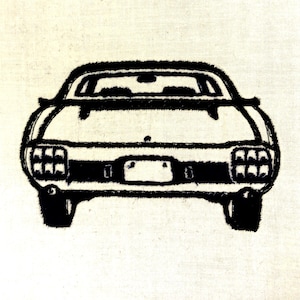 May include: Black and white illustration of a classic car, viewed from the rear. The car features a detailed outline with visible headlights, taillights, and a license plate area. The artwork is set against a neutral background.