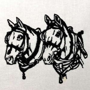 May include: Black and white embroidered image of two horses' heads side by side. The horses are wearing harnesses and have a striped pattern on their bodies.