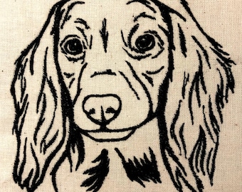 May include: Black and white line drawing of a dog's head with long, flowing hair. The dog is looking directly at the viewer with a gentle expression.