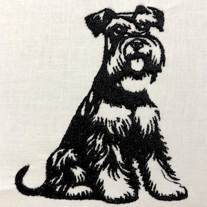 May include: Black and white embroidered image of a miniature schnauzer sitting with its legs crossed. The dog is facing forward with its head tilted slightly to the side.