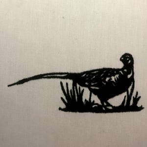 May include: Black silhouette of a pheasant standing in tall grass.