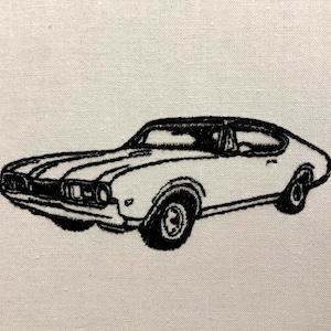 May include: Black and white line drawing of a classic car. The car is a coupe with a long hood and a short rear deck. The car has a large grille and round headlights. The car is sitting on a white background.