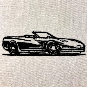May include: Black and white line drawing of a convertible sports car. The car is drawn in profile, with the front wheels visible. The car has a rounded body and a long hood.