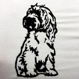 May include: Black embroidered image of a dog on white fabric. The dog is sitting, with its head turned to the side. The embroidery is detailed, showing the dog's fur and features. The background is plain white.