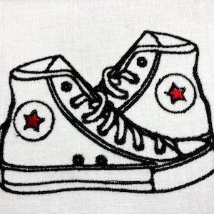 May include: Black and white embroidered design of a pair of white high-top sneakers with red stars on the sides.
