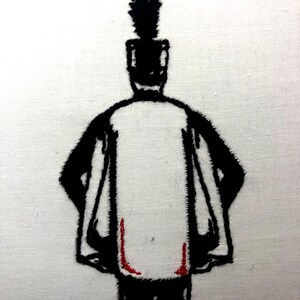 May include: Black and white embroidered image of a person wearing a tall hat with a plume, standing with their hands behind their back. The person is wearing a red sash.