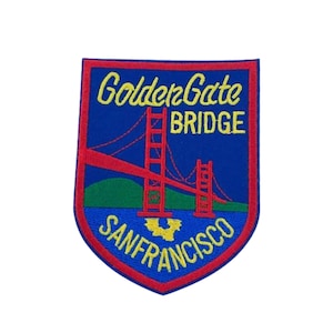 May include: A blue and red embroidered patch with the words "Golden Gate Bridge San Francisco" and an image of the Golden Gate Bridge.