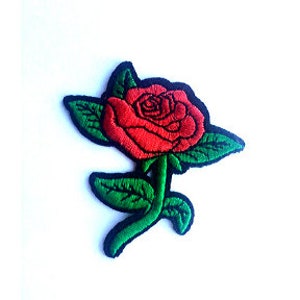May include: Red embroidered rose patch with green leaves and a black outline.