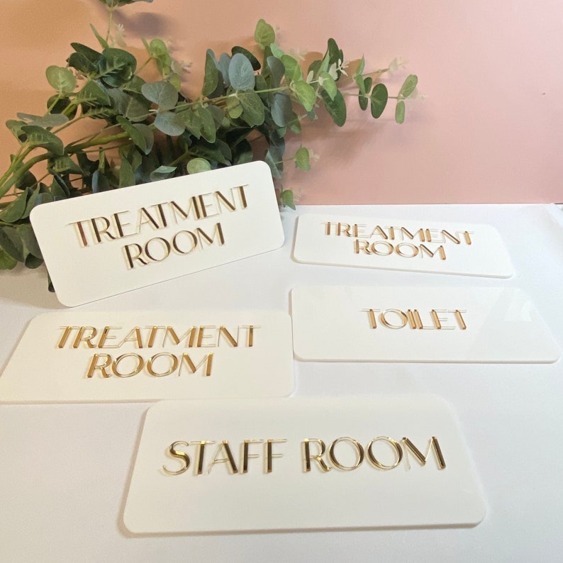 3D Acrylic business signage. Treatment room, staff room and toilet signs made from acrylic in matt white with 3d mirror acrylic writing.
