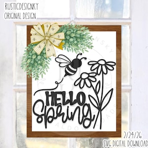 May include: A wooden framed sign with the words "HELLO SPRING" in black script. The sign features a black bee and daisy design, with a green leaf and yellow bow accent. The sign is a digital download.