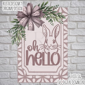 May include: A pink and white Easter-themed sign with a bunny illustration and the words "oh hello". The sign is decorated with a bow and greenery. The text "RUSTICDESIGNKY ORIGINAL DESIGN" is at the top left.