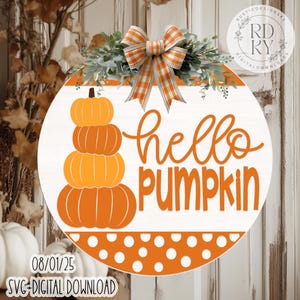 May include: A circular wooden sign with the words "hello PUMPKIN" in orange script. A stack of orange pumpkins is on the left. The sign is decorated with a plaid bow and greenery. The bottom has an orange polka dot design.