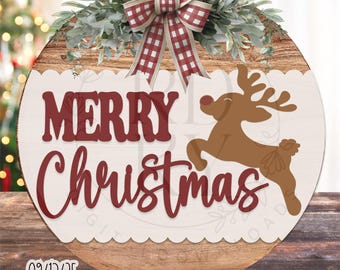 May include: A circular wooden Christmas sign with a white scalloped edge. It displays the words "MERRY Christmas" in burgundy script, a brown reindeer, and a red and white checked bow. The text "RUSTICDESIGNSKY" is at the top.