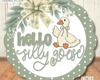May include: A circular sign with a scalloped edge, featuring a cartoon goose and the words "hello silly goose". The design includes a bow and foliage. The text "RUSTICDESIGNKY ORIGINAL DESIGN" is at the top. The border is green with white polka dots.